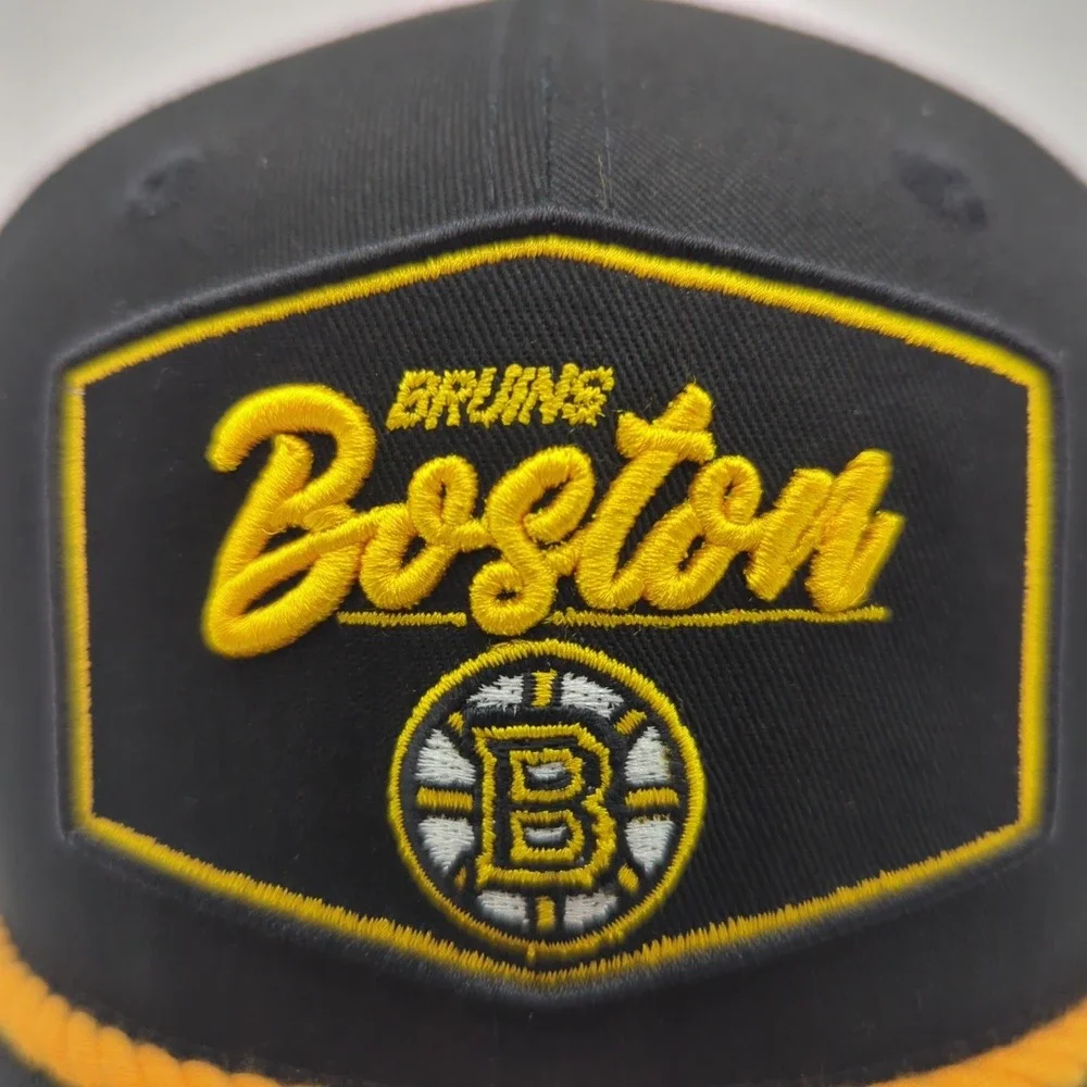 New Era 9SEVENTY Boston Bruins Hat Mens Black White Stretch Snap Trucker Cap NHL